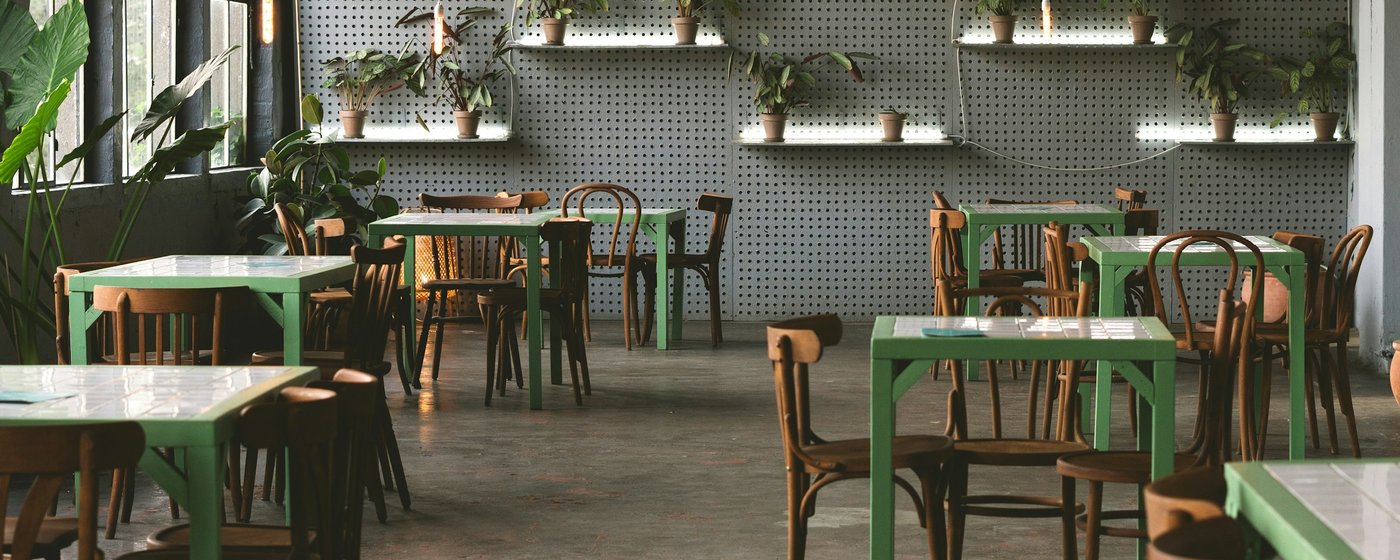 Cafe interior with plants and seating